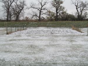 The garden is cleared and tilled and now sprinkled with snow.